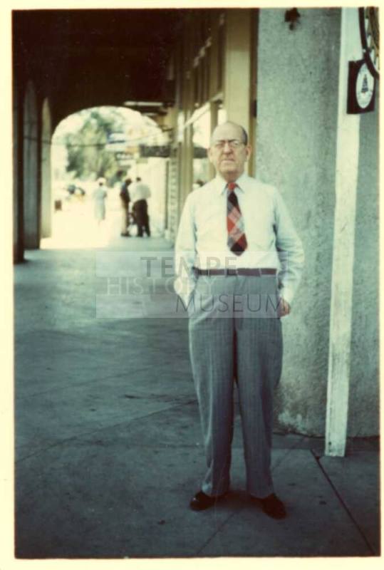 Bill Laird outside the front of a store