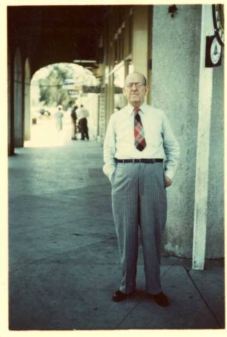 Bill Laird outside the front of a store