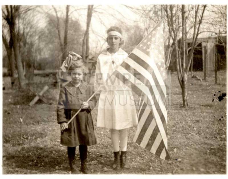 Minnie Laird with Little Girl Who's Holding a Flag