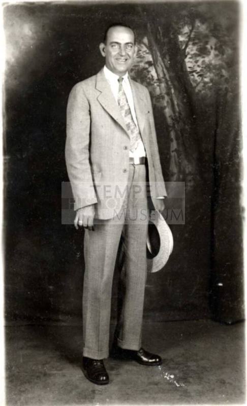 Portrait of William Laird in a suit holding a hat