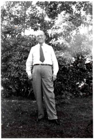 Photo of William Laird standing under trees