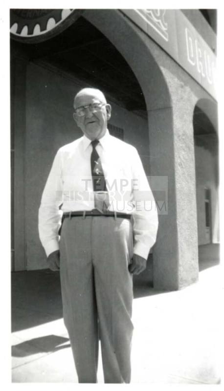 Photo of William Laird outside a building with arches