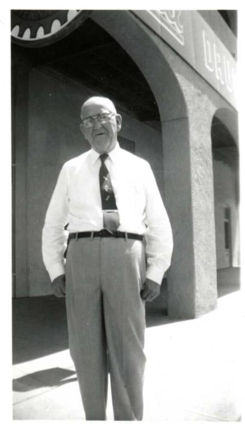 Photo of William Laird outside a building with arches