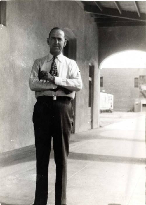 William Laird standing outside of Laird's Drugs, Under the Overhang.