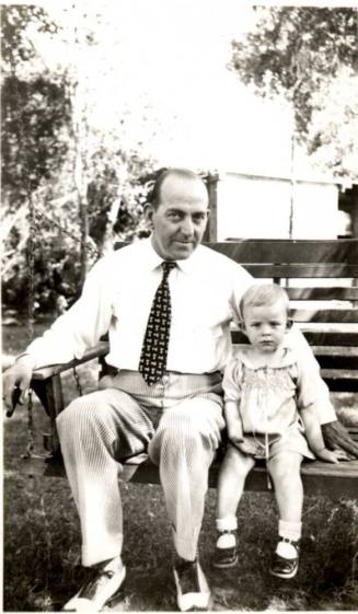 Willaim E Laird and a Small Girl Sitting on a Bench