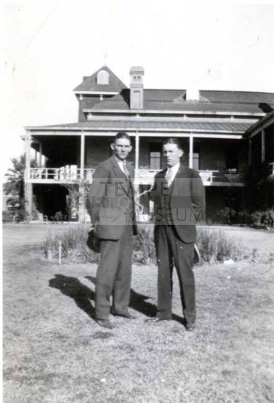Photo of John and Frank Raymond in front of University of Arizona Tucson Old Main
