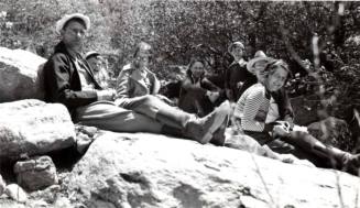 Minnie Raymond and her Inlaws Sitting on Rocks