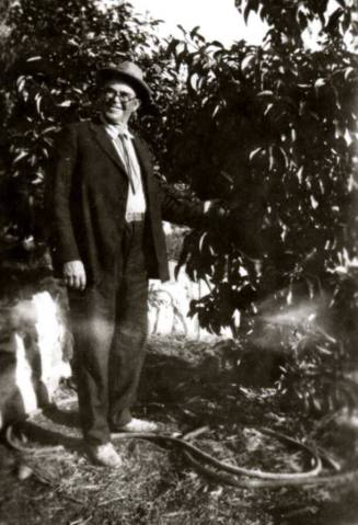 Ed Walker from San Diego standing in orchard
