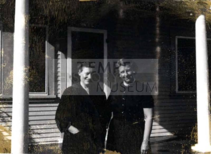 Ann and Minnie Raymond Between Porch Columns