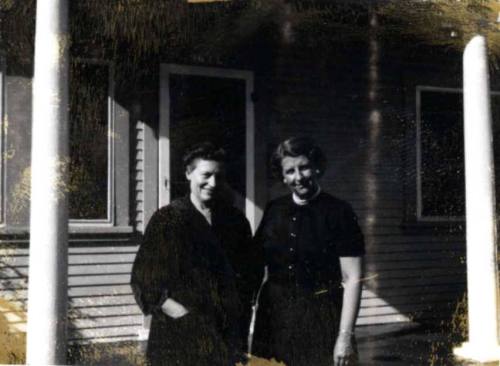 Ann and Minnie Raymond Between Porch Columns