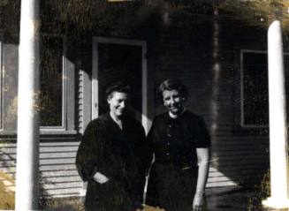 Ann and Minnie Raymond Between Porch Columns