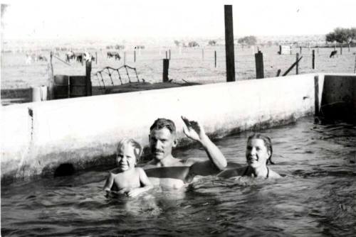 Dickie, Lee, and Blanche Raymond in a Ranch Watering Tank