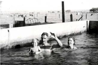 Dickie, Lee, and Blanche Raymond in a Ranch Watering Tank