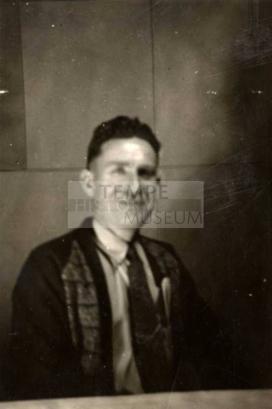 Photo of Frank Raymond sitting at a table
