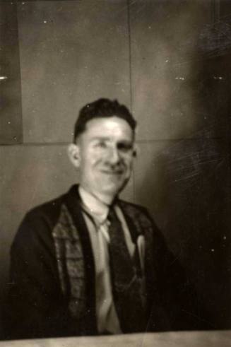 Photo of Frank Raymond sitting at a table