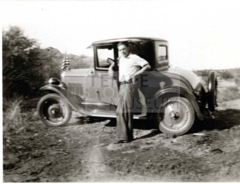 Frank Raymond Posing Infront of a 1920's Car