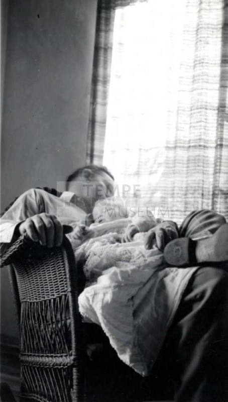 Frank Raymond Holding a Baby