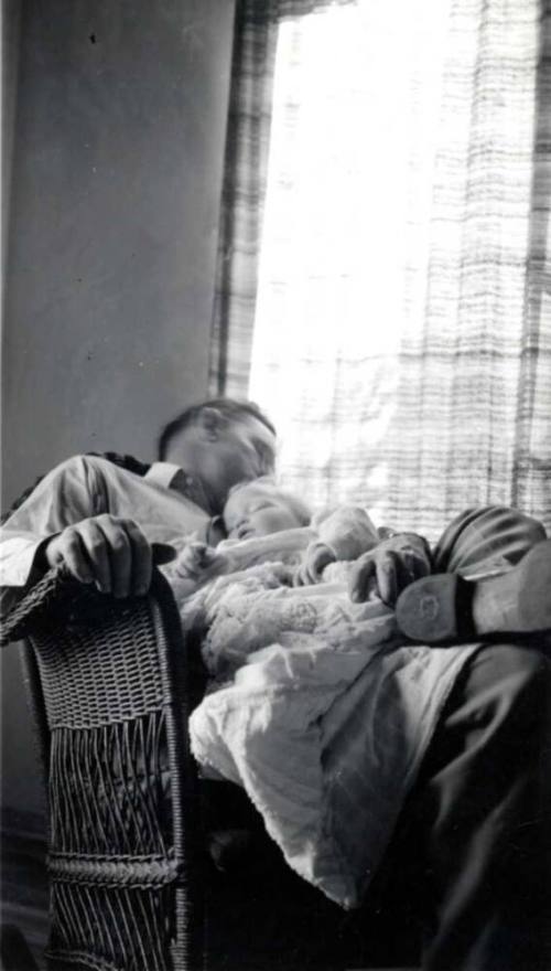 Frank Raymond Holding a Baby