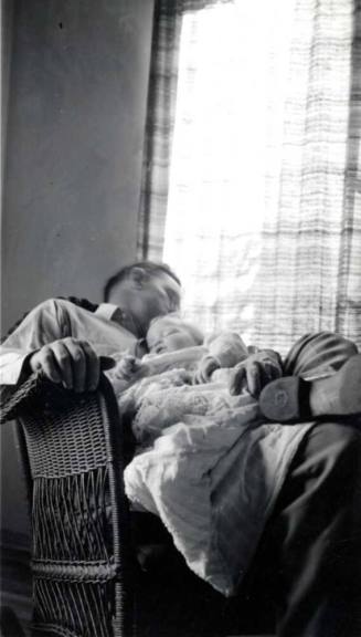 Frank Raymond Holding a Baby