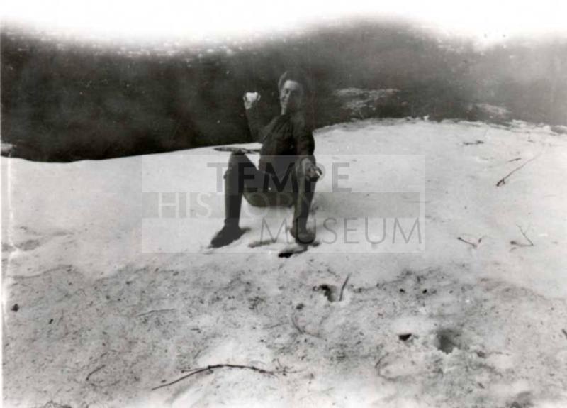 Frank Raymond sitting in the sand