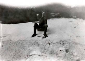 Frank Raymond sitting in the sand
