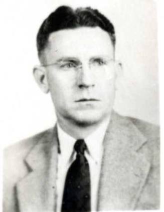 Portrait of Frank Raymond wearing glasses