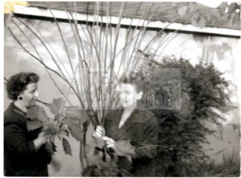 Minnie Laird Raymond and Ann Raymond Fischer Holding Plants