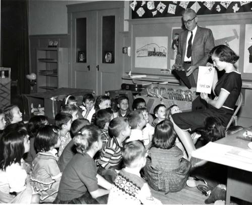Young Teacher Teaching her Kindergarten Class about Tools