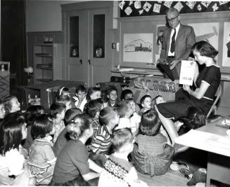Young Teacher Teaching her Kindergarten Class about Tools