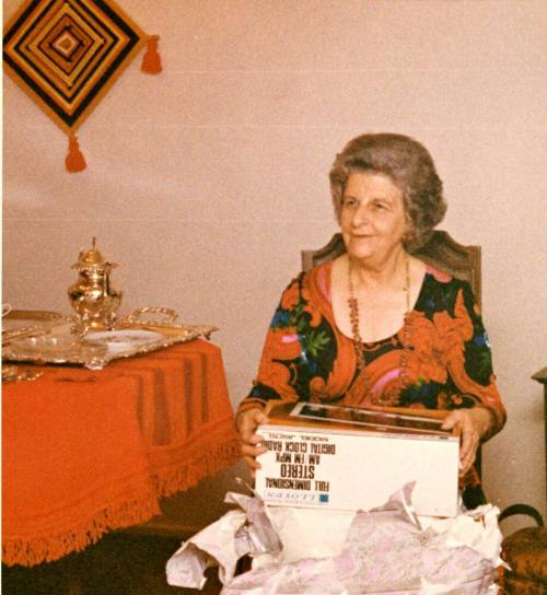 Minnie Laird Raymond Opening Gifts at a Faculty Tea Party