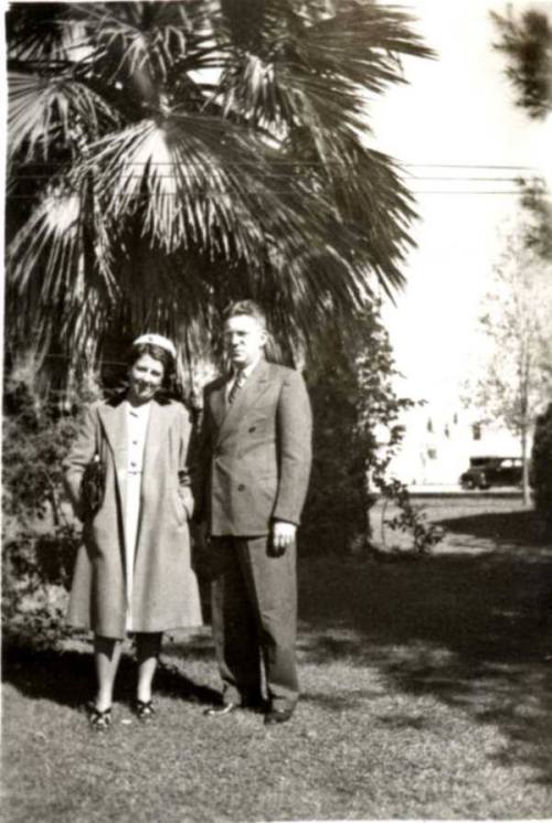 Minnie and Frank Raymond Standing on a Lawn