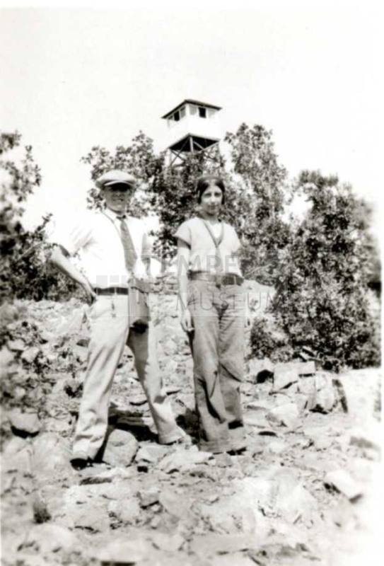 Frank Raymond and Minnie Laird Pose in Front of Watch Tower