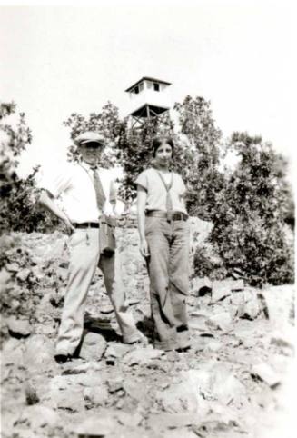 Frank Raymond and Minnie Laird Pose in Front of Watch Tower