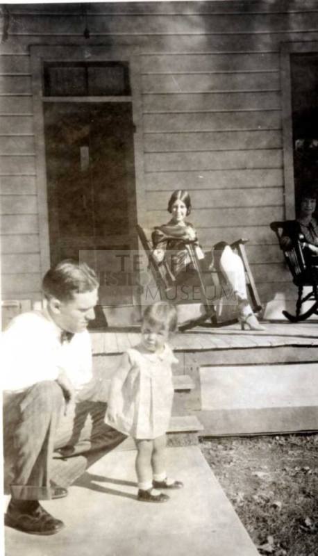 Frank Raymond Kneels next to Little Girl