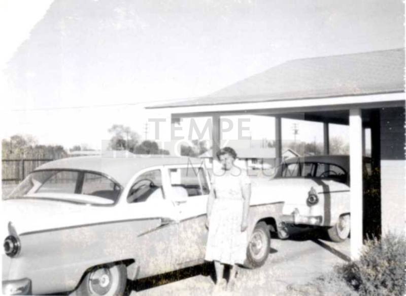 Minnie Raymond Standing Next to Car
