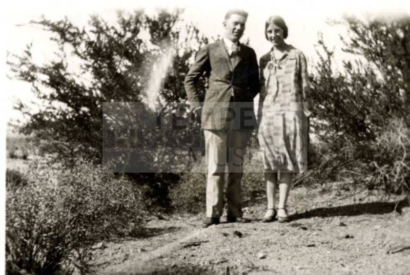 Frank and Minnie Raymond Pose in the Brush