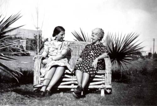 Minnie (Laird) Raymond and Nell (Cummins) Laird Sit on a Bamboo Bench