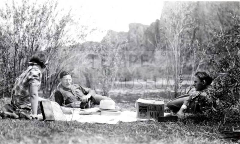 Minnie, Frank, and John Raymond Enjoy a Picnic Outdoors