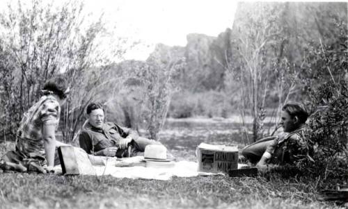 Minnie, Frank, and John Raymond Enjoy a Picnic Outdoors