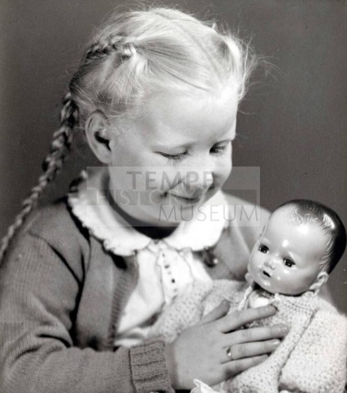 Young Girl with Baby Doll