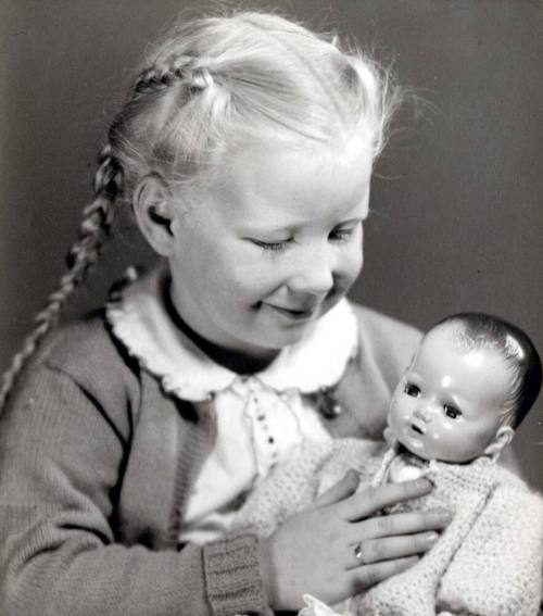 Young Girl with Baby Doll