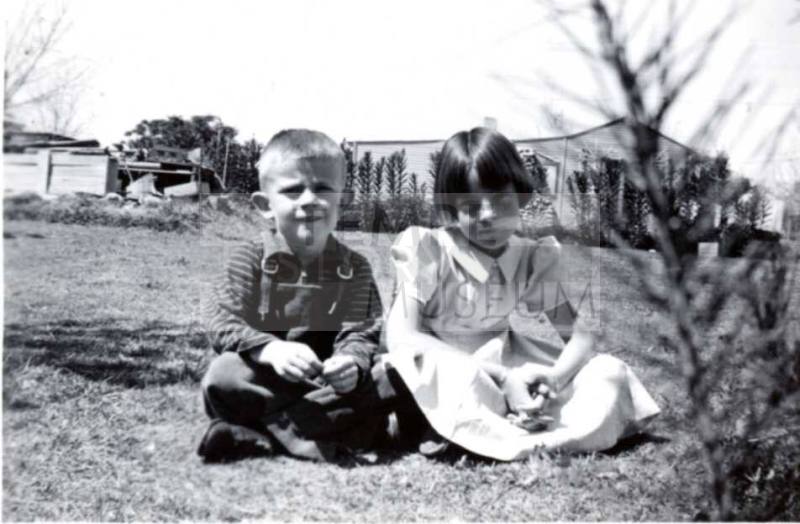 Bill and Joann Raymond Sit Nicely on a Lawn