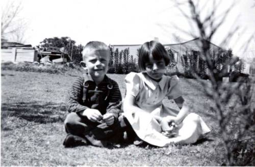Bill and Joann Raymond Sit Nicely on a Lawn