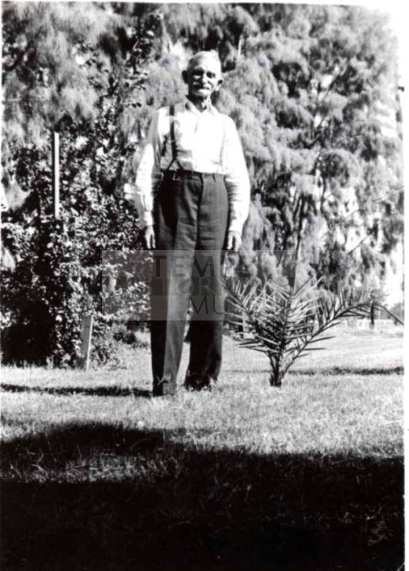 Wilbur Raymond Poses for a Photo