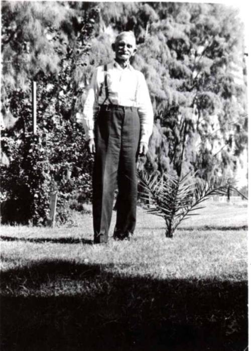 Wilbur Raymond Poses for a Photo