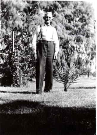 Wilbur Raymond Poses for a Photo