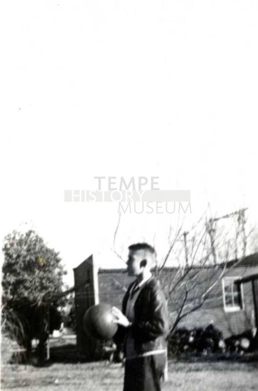 William Raymond About to Throw a Basketball