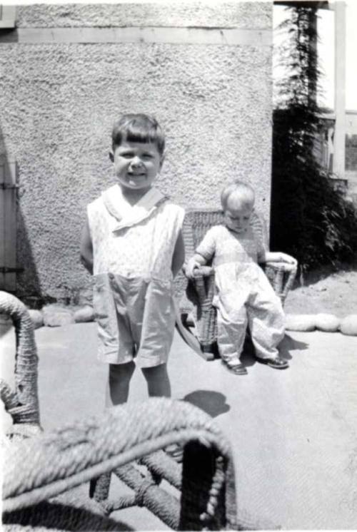 William Raymond Stands Posing for a Photo