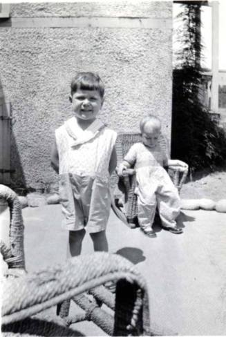 William Raymond Stands Posing for a Photo