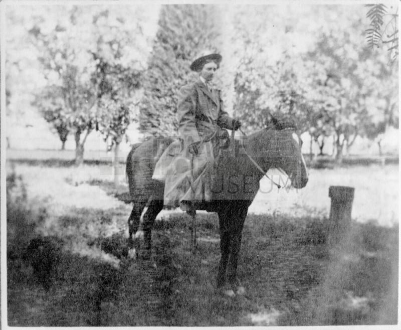 Woman on horse at Petersen House